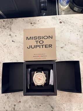 Omega Cream Dial Watch with Black Strap and Orange Accents